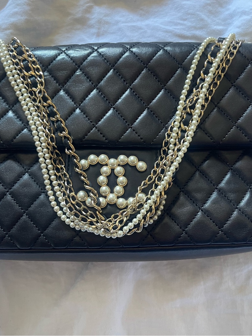 CHANEL Black Quilted Leather Shoulder Bag with Pearl CC and Gold Chains